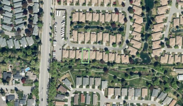 Aerial view of 59 - 1201 Cameron Ave showing houses and yards
